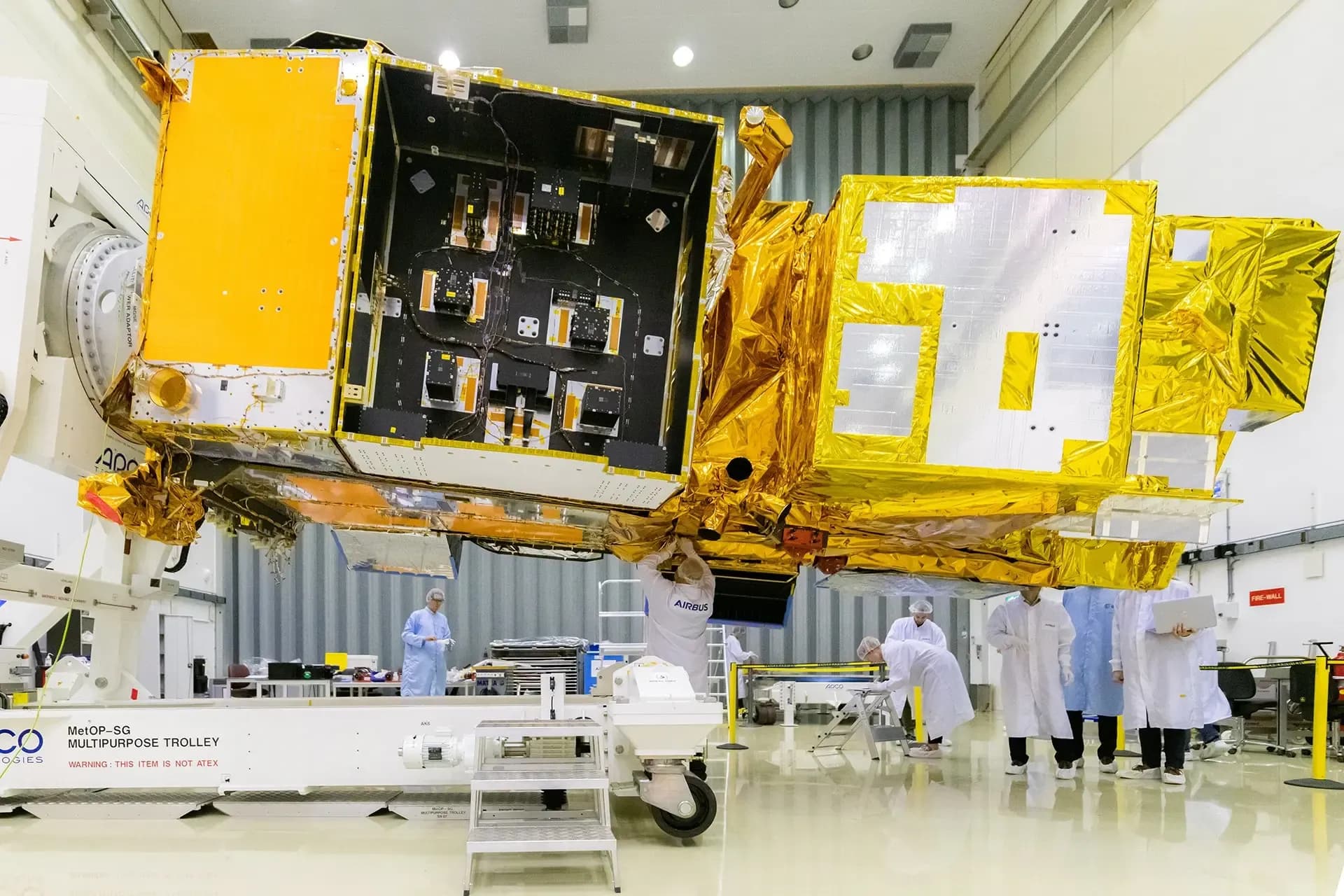 Satellite hardware in a clean room, pictured on Inventas’s FPGA and ASIC engineering page